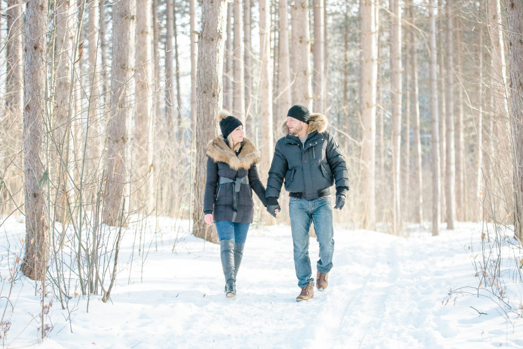 pine grove trail Winter Engagement Session grey loft studio ottawa wedding photographer videographer engagement kanata orleans nepean beautiful locations for engagement photos in ottawa black coats and tan coloured accents with jeans
