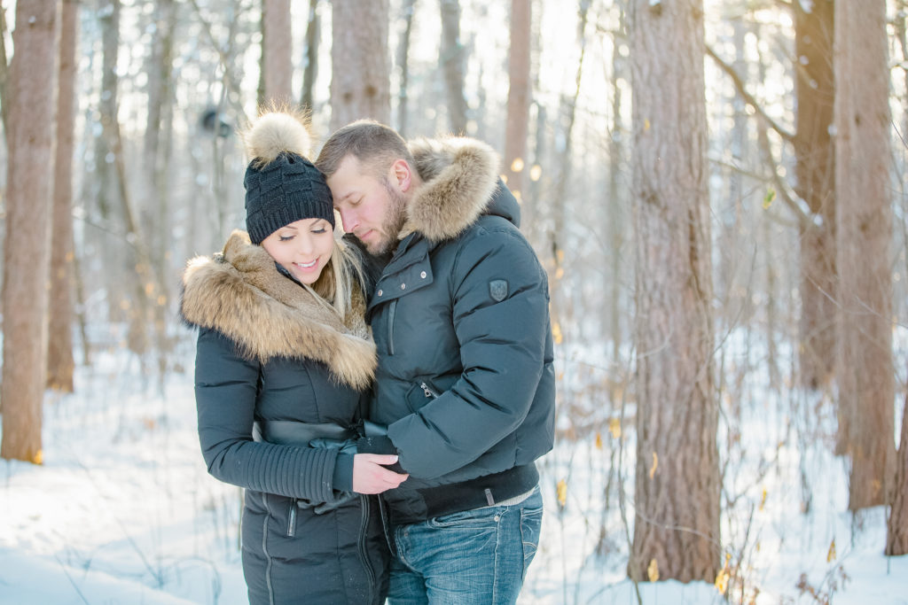 pine grove trail Winter Engagement Session grey loft studio ottawa wedding photographer videographer engagement kanata orleans nepean beautiful locations for engagement photos in ottawa black coats and tan coloured accents with jeans