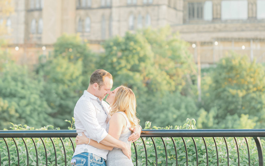 Grey loft studio wedding photographer ottawa wedding videographer ottawa wedding photographer kanata bright and airy true to colour photography couple dancing and kissing in front of parliament hill 