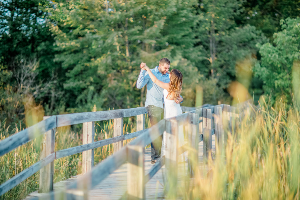 mer bleue bog engagement session in the fall backless white dress and blue dress shirt on the guy with jeans fall colour engagement session romantic engagement grey loft studio ottawa wedding photographer videographer 