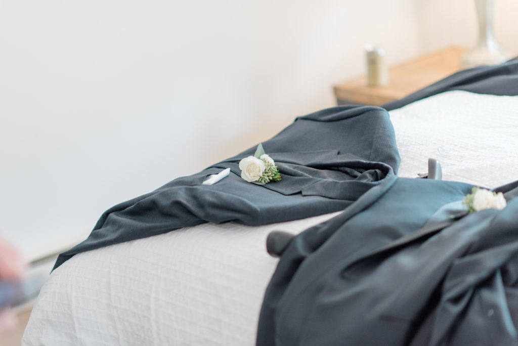 Groomsmen jackets ready on the Bed - Before the wedding - Prep Shots