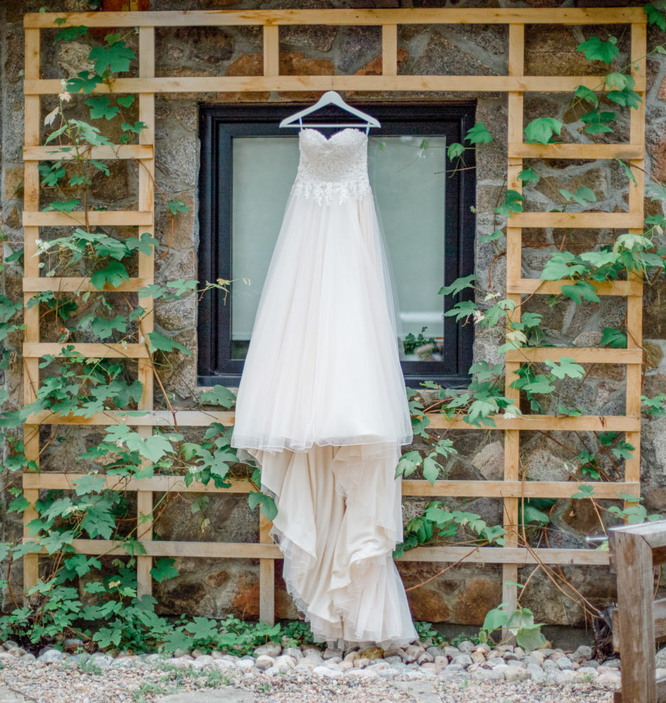 Wedding Dress hanging outside of Getting Ready Space - Grey Loft Studio - Ottawa Photographer 