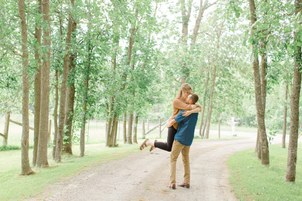 Frolic - Natural Posing for Photo Session - Couples Photo Session Fun - Fun on the Farm - Farm Engagement Session - Blue and Brown Engagement Session Inspiration - Natural Engagement Session Posing - Ideas for what to wear for Engagement Photography, Modern Engagement Session Inspiration Wardrobe Ideas. Unsure of what to wear for your engagement photos, we've got you! Romantic brown with black leggings for Summer Engagement in Almonte. Grey Loft Studio is Ottawa's Wedding and Engagement Photographer for Real couples, showcasing photos that are modern, bright, and fun.