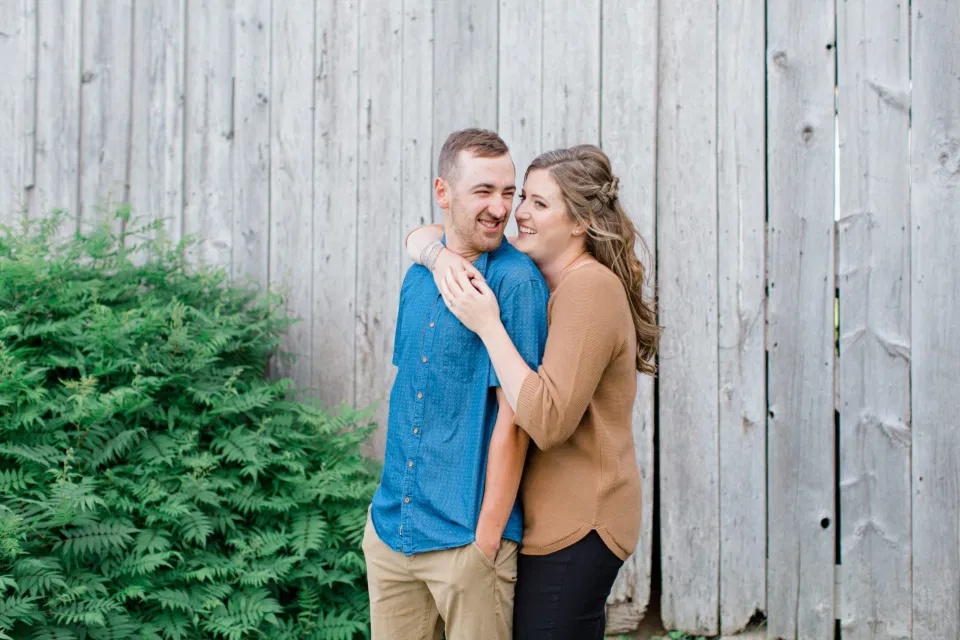 Blue and Brown Engagement Session Inspiration - Natural Engagement Session Posing - Ideas for what to wear for Engagement Photography, Modern Engagement Session Inspiration Wardrobe Ideas. Unsure of what to wear for your engagement photos, we've got you! Romantic brown with black leggings for Summer Engagement in Almonte. Grey Loft Studio is Ottawa's Wedding and Engagement Photographer for Real couples, showcasing photos that are modern, bright, and fun.