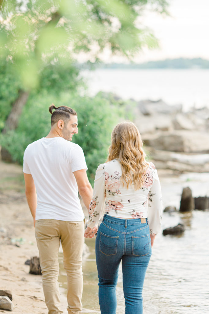  Walking on the Beach - Ideas for what to wear for Engagement Photography, Modern Engagement Session Inspiration Wardrobe Ideas. Unsure of what to wear for your engagement photos, we've got you! Romantic floral shirt & jeans.  White T-shirt & neutral pants . Boat Shoes and Fancy. beaded sandals. Engagement at Petrie Island, Orleans. Grey Loft Studio is Ottawa's Wedding and Engagement Photographer Videographer for Real couples, showcasing photos that are modern, bright, and fun.