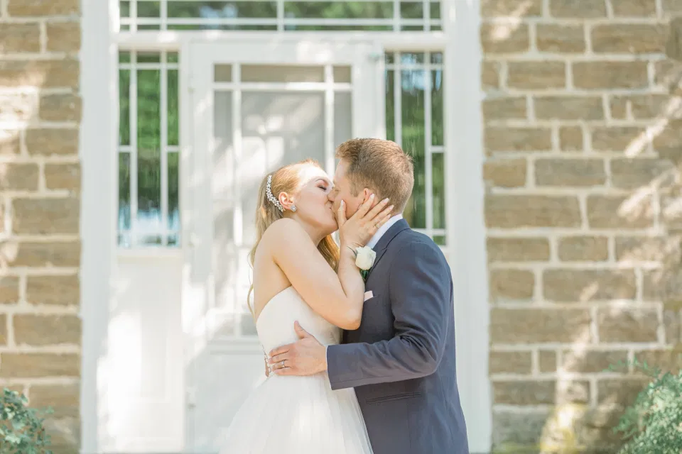 First Kiss as Husband and Wife -  Stonefields Estate-  Bright and Airy - Natural Wedding Posing - Modern Wedding Blush &. Navy Wardrobe inspiration-  Romantic white with greenery, blush and navy theme. Grey Loft Studio is Stonefields Wedding and Engagement Photographer for Real couples, showcasing photos that are modern, bright, and fun.