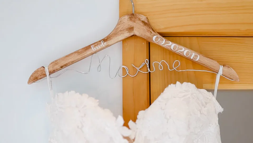 Custom Wedding Hanger with Wire Writing- Off-White, Silver, Greenery. Eucalyptus Leaves. An inspiration filled with soft neutrals, lush florals, and layers of romantic textures all set at Evermore Weddings and Events, Almonte Ontario. 
Shot with Stephanie Mason Photography & Co + Grey Loft Studio. 