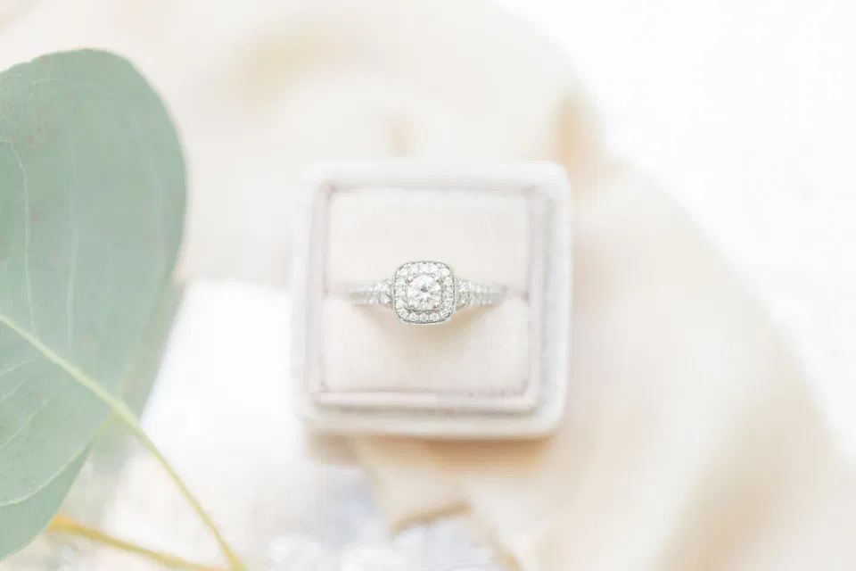 Wedding Ring Shot in Mrs. Box - Off-White, Silver, Greenery. Eucalyptus Leaves. An inspiration filled with soft neutrals, lush florals, and layers of romantic textures all set at Evermore Weddings and Events, Almonte Ontario. 
Shot with Stephanie Mason Photography & Co + Grey Loft Studio. 