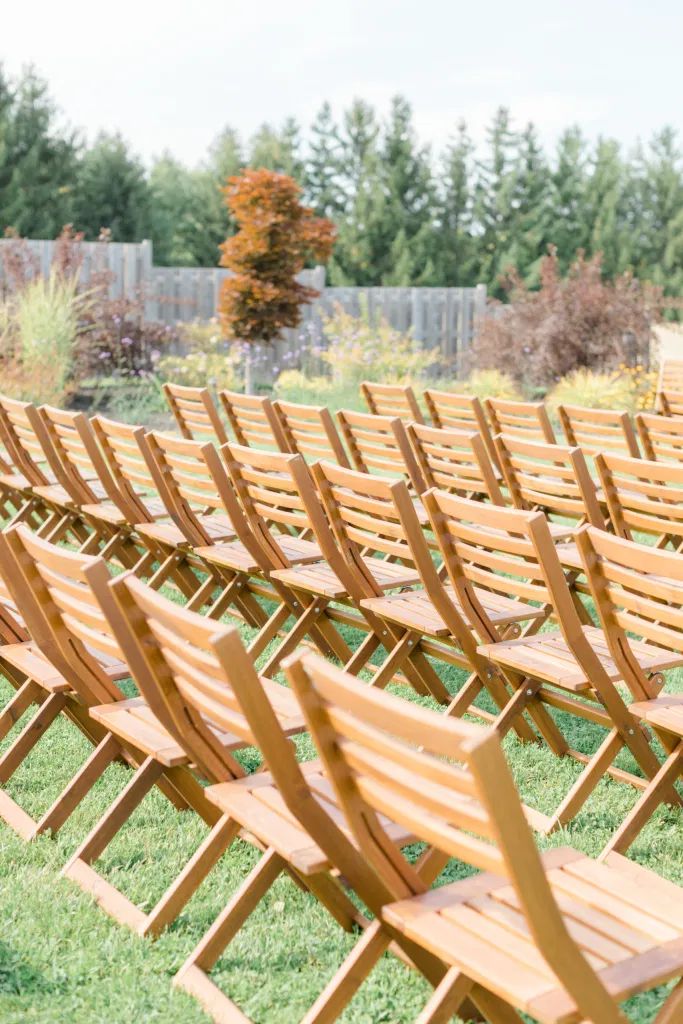 Beautiful Landscapes with beautiful Ceremony Decor -Floral inspiration - Outdoor Ceremony With Wooden Modern Brown Wood Chairs. Interlock, beautiful Landscapes at Evermore Weddings and Events, Almonte Ontario - Grey Loft Studio