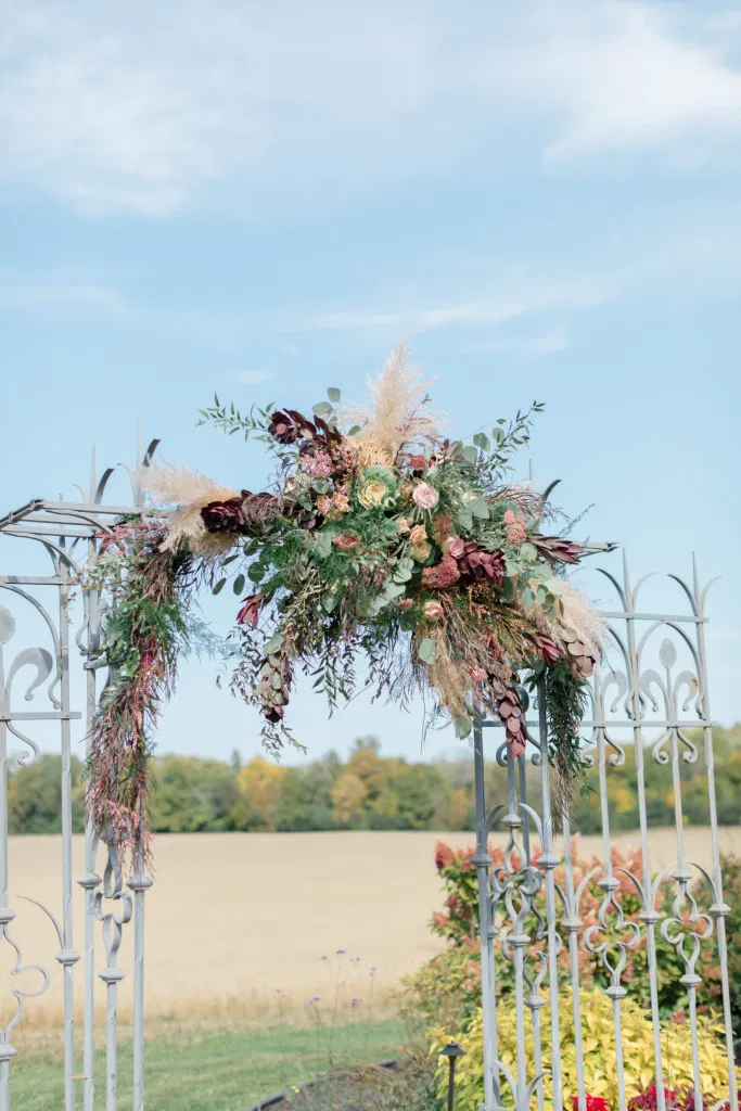 Beautiful Landscapes with beautiful Ceremony Decor -Floral inspiration - Outdoor Ceremony With Wooden Modern Brown Wood Chairs. Interlock, beautiful Landscapes at Evermore Weddings and Events, Almonte Ontario - Grey Loft Studio