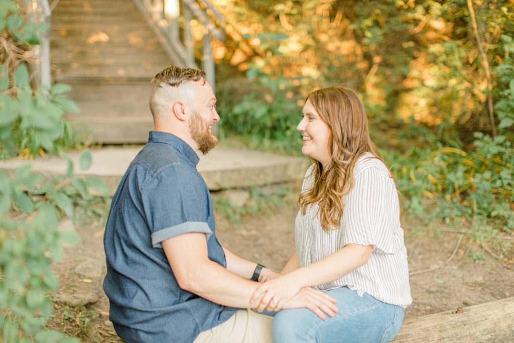 sitting on a log - fun times during engagement session