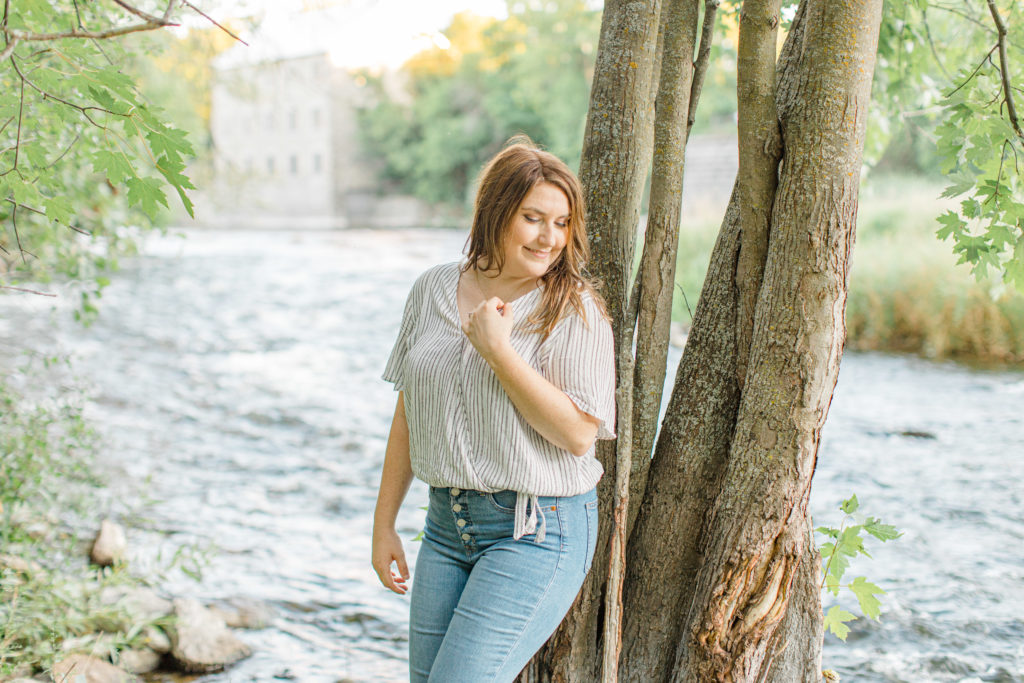 sunset by the water - Watson's Mill Engagement Session Manotick - Bright & Airy photography - Grey Loft Studio - Ottawa Wedding Photographer - Ottawa Wedding Videographer - Engagement Session Locations in Ottawa - Summer Engagement session - Light blue and Cream with casual jeans and strap sandals. Ottawa Photo Studio.