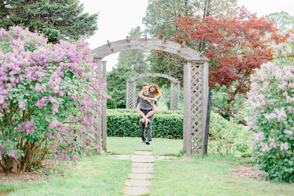 Pose Ideas for Photos - Couple Photo Ideas - Cute couple having fun! Engagement Photo Poses & ideas - during Engagement Session Ottawa - at the Arboretum in Ottawa. 
Pink & Grey, taupe heels, florals, and a charcuterie board. Grey Loft Studio Wedding Photographers & Videographers. 