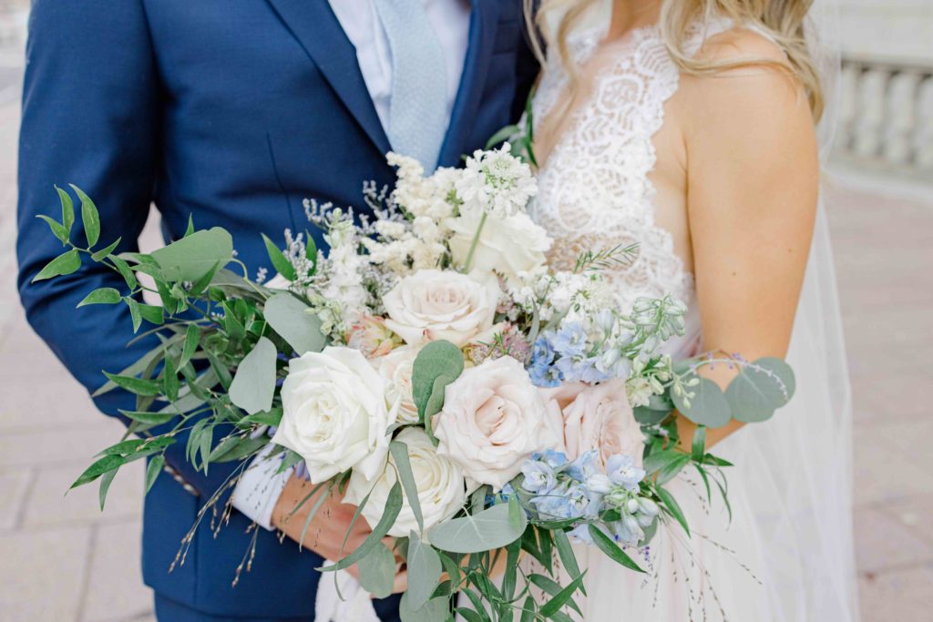 Must have Bouquet Shot at your Wedding - Blue Suit, big floral bouquet, beautiful braided & curled hair. Grey Loft Studio -Ottawa Wedding Photographer
