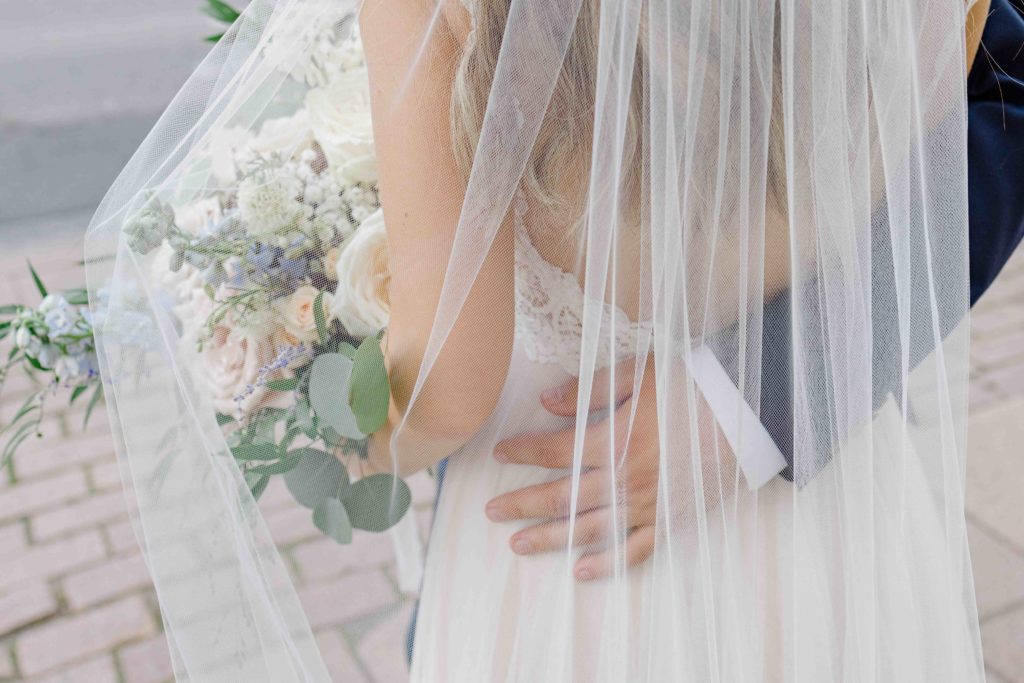Blue Suit, big floral bouquet, beautiful braided & curled hair. Grey Loft Studio -Ottawa Wedding Photographer